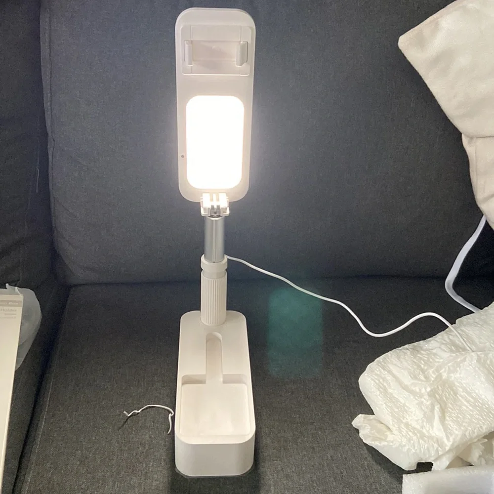 Foldable mobile phone holder
